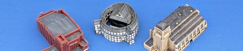 Three very small scale model buildings - a cinema, theatre and radio station